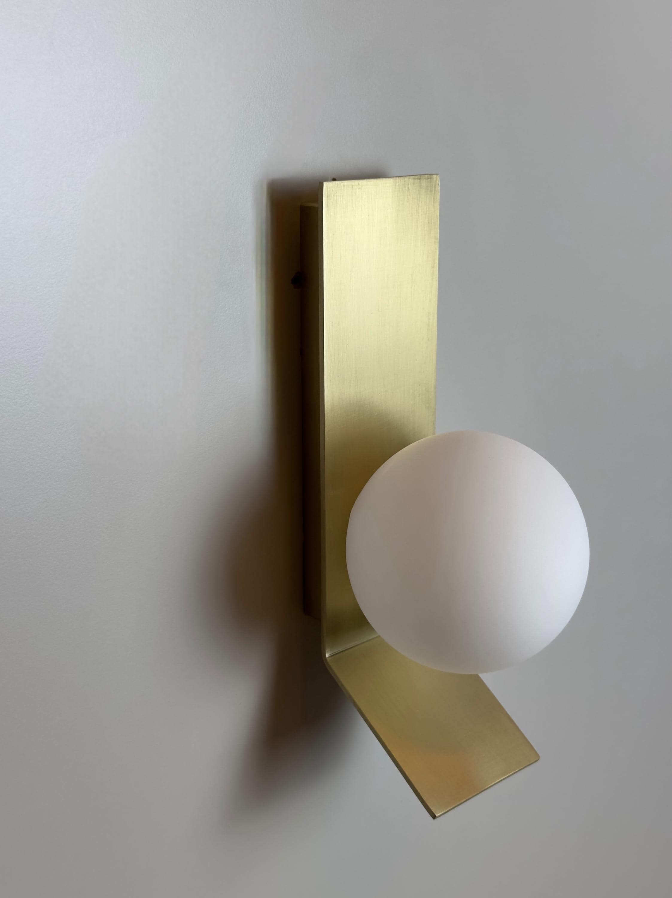 Tetragone Wall Sconce: Modern Brushed Brass with Frosted Glass Globe