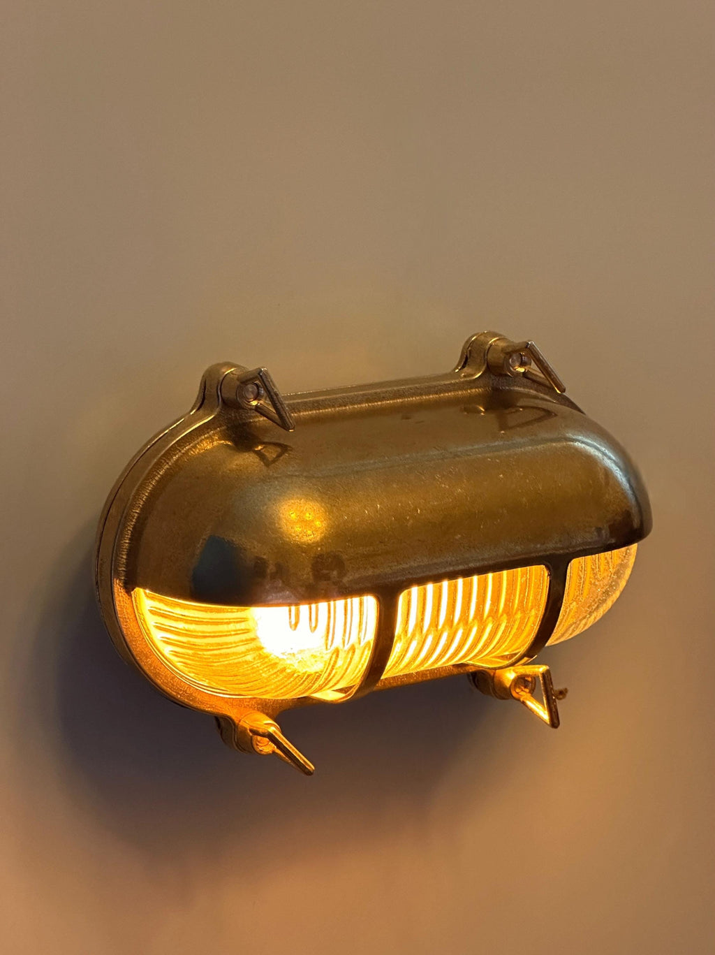 Gnarp Brass Outdoor Wall Sconce – Nautical Bulkhead Light with Ribbed Glass