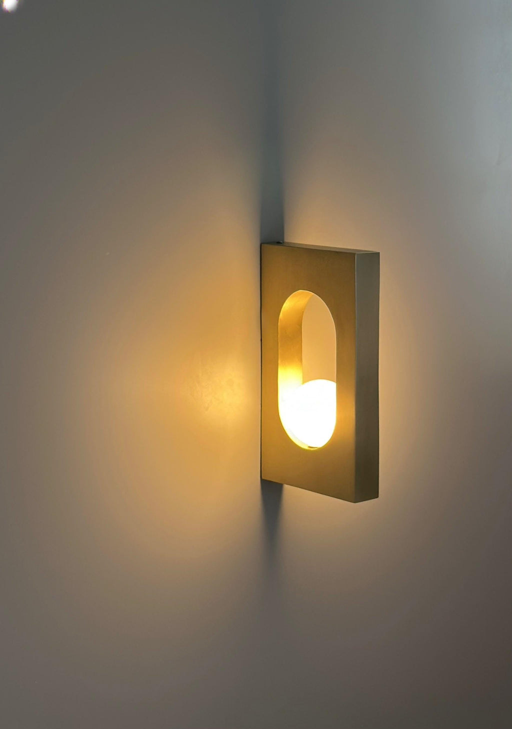 Ecowa Wall Sconce – Minimalist Brass Accent Fixture with Warm Ambient Glow