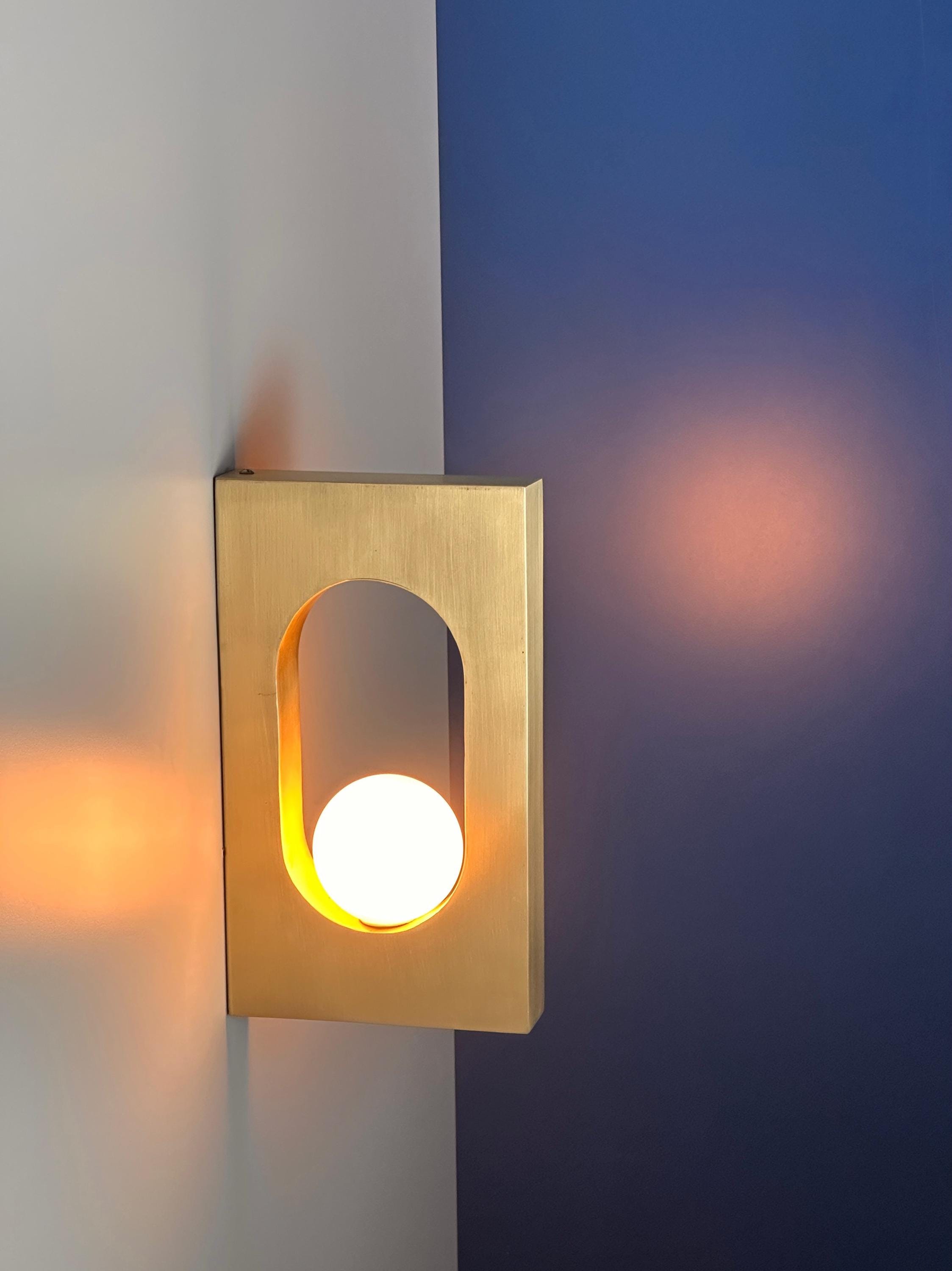 Ecowa Wall Sconce – Minimalist Brass Accent Fixture with Warm Ambient Glow