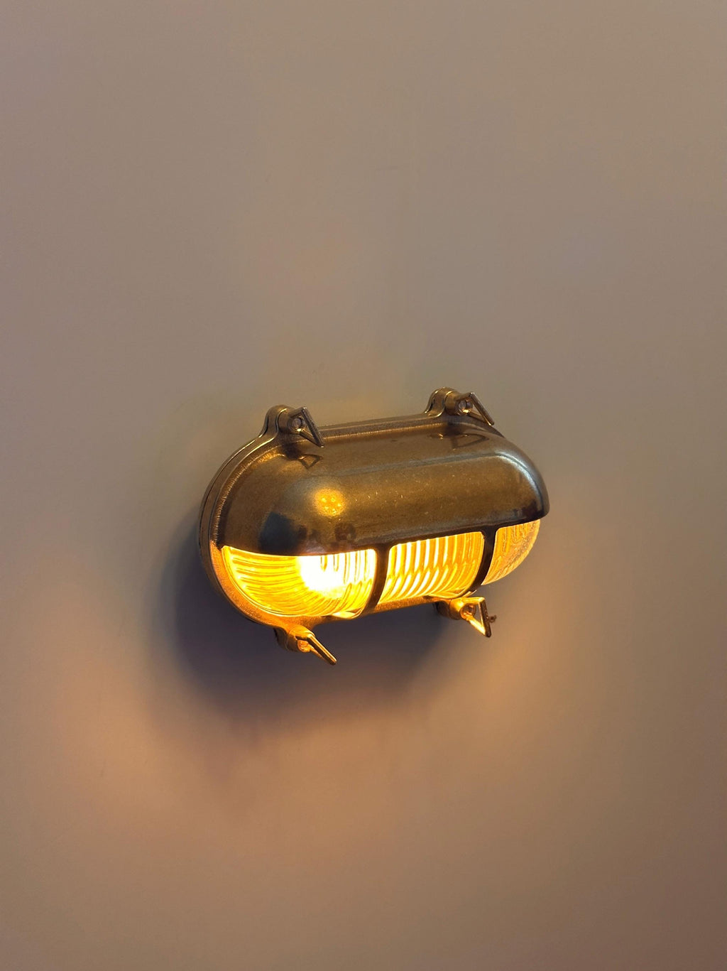 Gnarp Brass Outdoor Wall Sconce – Nautical Bulkhead Light with Ribbed Glass