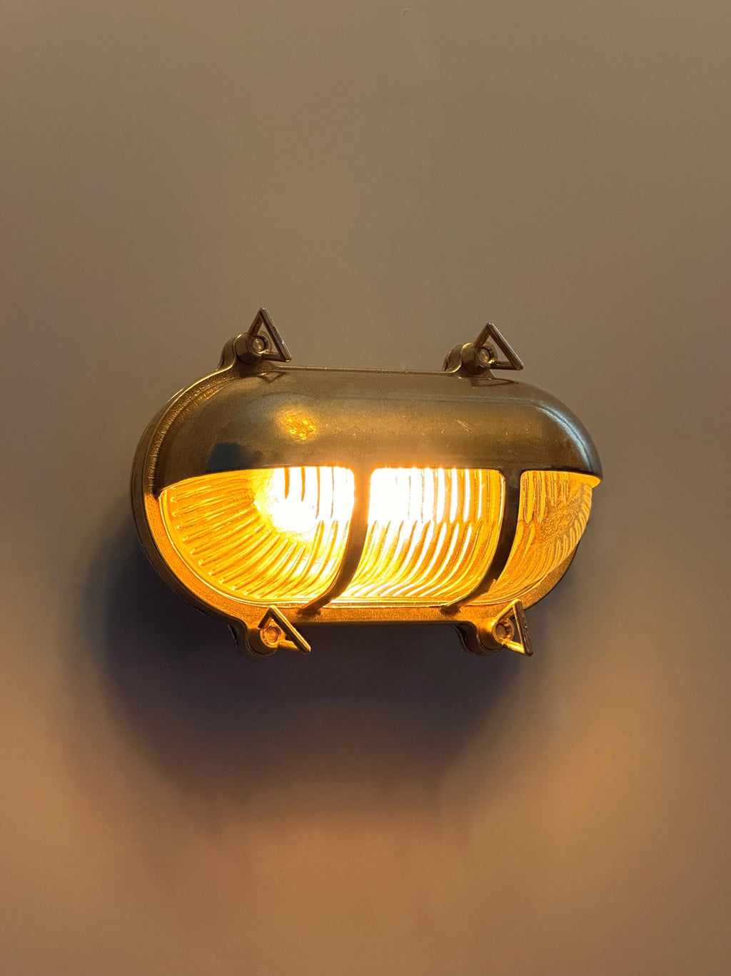 Gnarp Brass Outdoor Wall Sconce – Nautical Bulkhead Light with Ribbed Glass