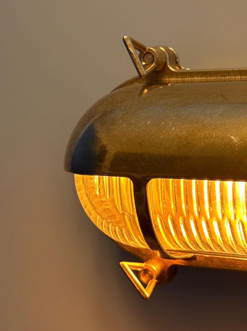 Gnarp Brass Outdoor Wall Sconce – Nautical Bulkhead Light with Ribbed Glass