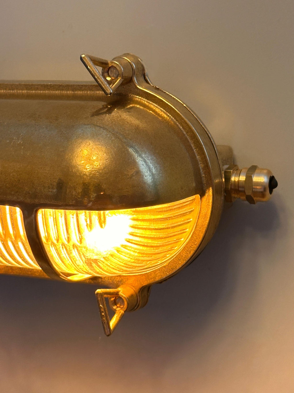 Gnarp Brass Outdoor Wall Sconce – Nautical Bulkhead Light with Ribbed Glass